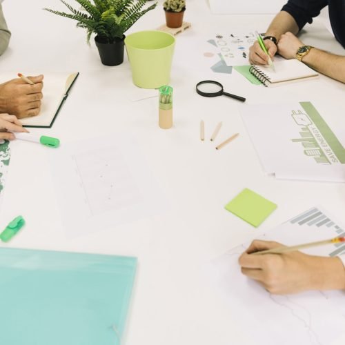 group-businesspeople-hand-white-desk